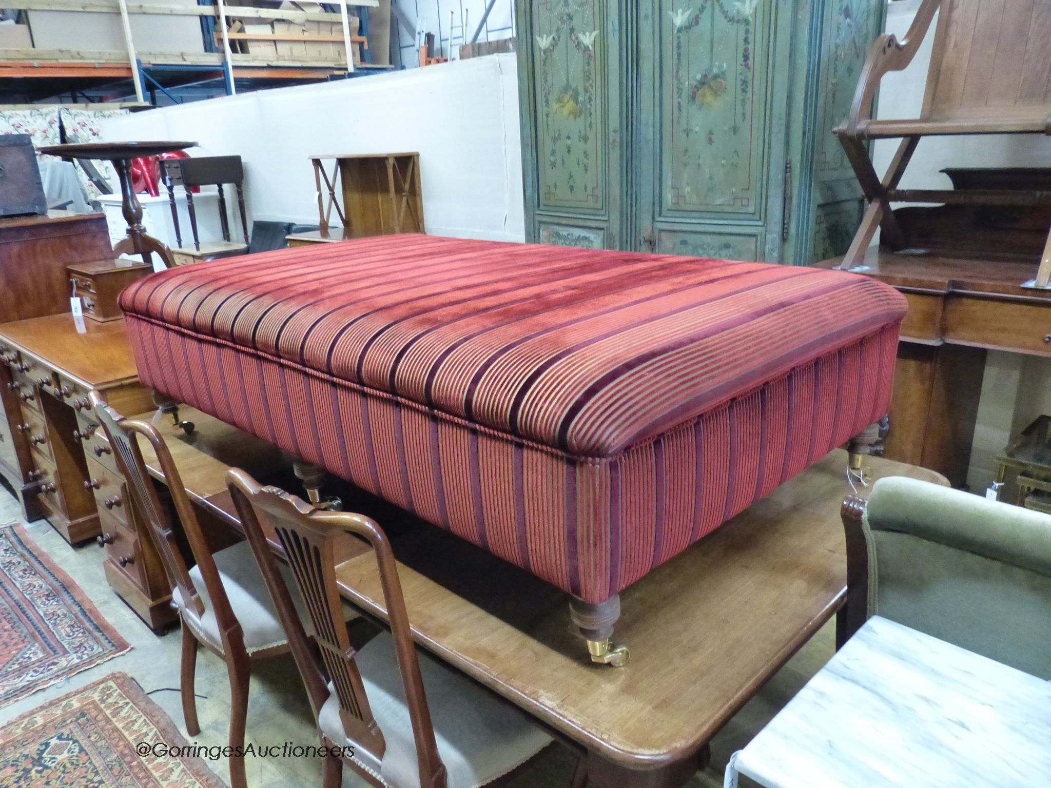 A large Victorian style footstool on six turned feet, length 156cm, depth 91cm, height 42cm